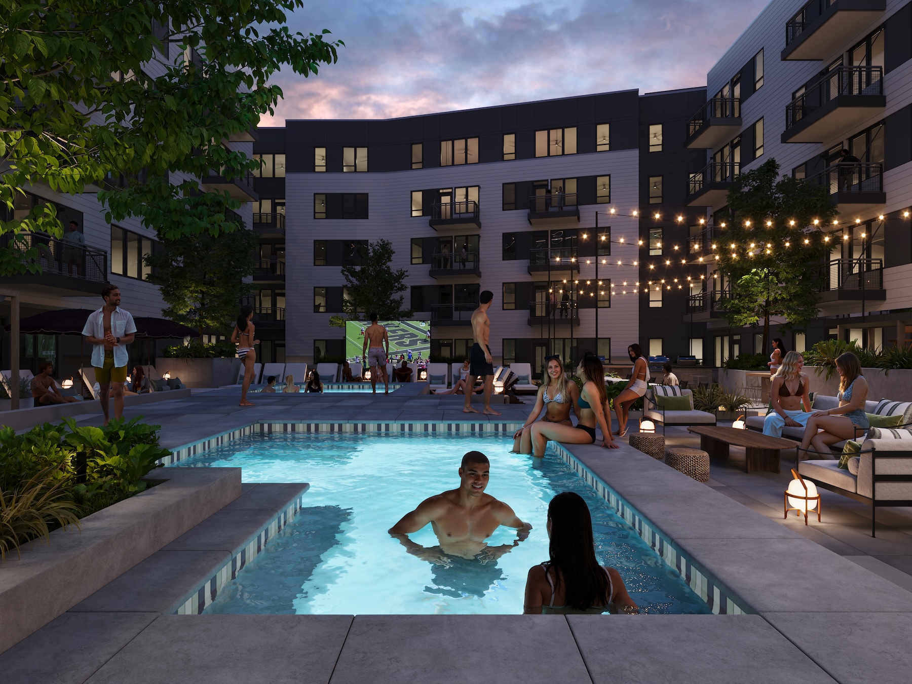 Rambler Riverfront Building B pool courtyard with the jumbotron playing the Purdue Boilermakers football game